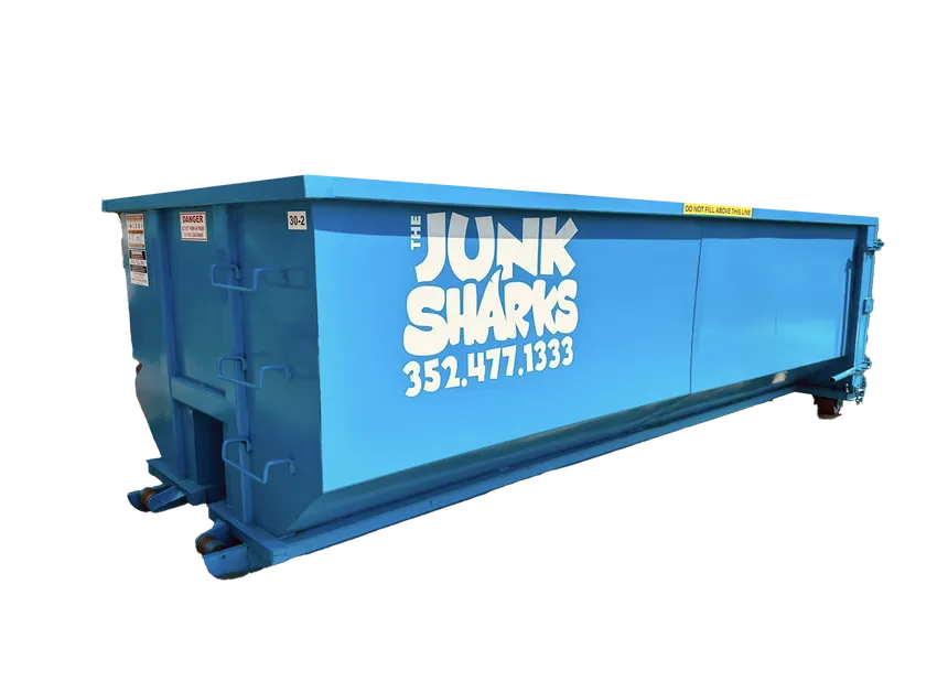 Junk Sharks roll-off dumpster placed driveway-safe at an Ocala home